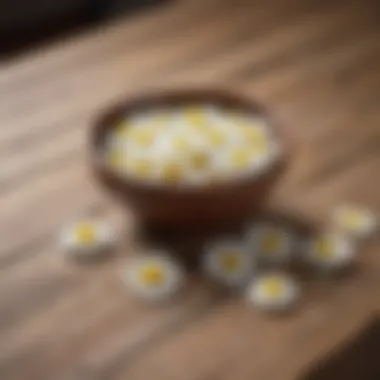 Close-up of chamomile tablets on a wooden table.