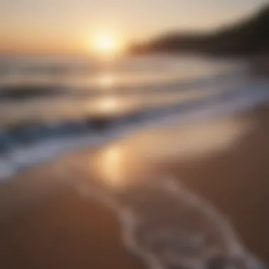 A calm beach at sunset, with waves gently lapping at the shore