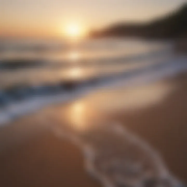 A calm beach at sunset, with waves gently lapping at the shore