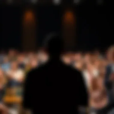 A silhouette of a speaker in front of an audience