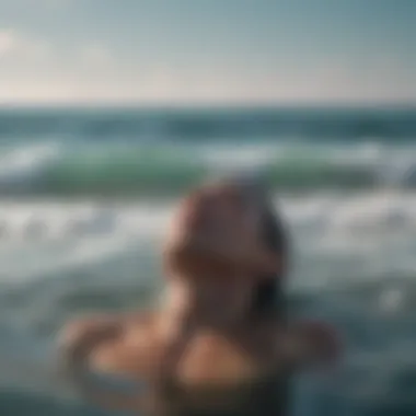 Person doing breathing exercises by the ocean