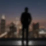 Silhouette of a person standing in front of a blurred cityscape