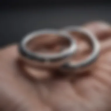 Two intertwined silver rings symbolizing a hidden connection