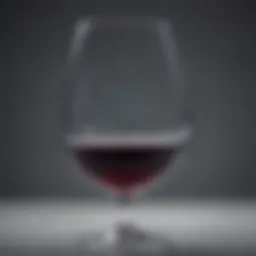 A close-up view of a wine glass half full, symbolizing moderation in drinking.