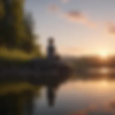 A person meditating by a calm lake at sunset