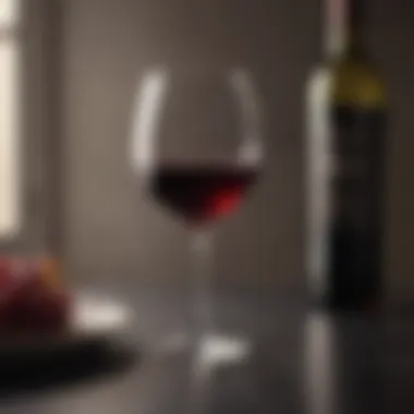 Elegant Red Wine Glass on Stylish Table Glass of red wine on a sophisticated table setting