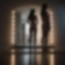 Silhouette of a person standing in front of a mirror