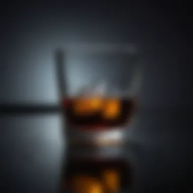 Close-up of a glass filled with a dark beverage reflecting the struggles of addiction.