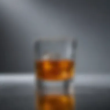 Reflection on Alcohol's Impact A close-up of a glass filled with alcohol, reflecting on the consequences